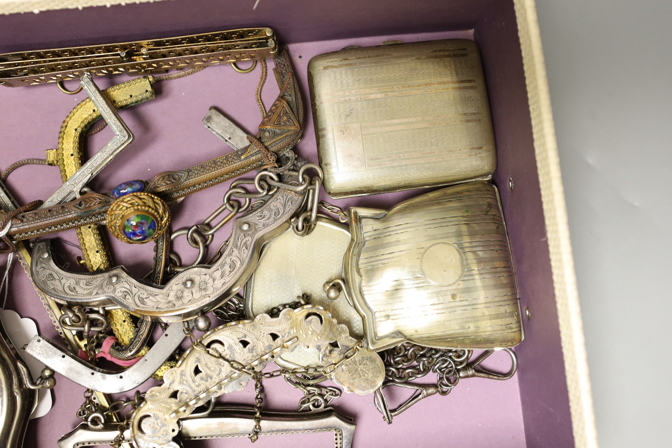 A collection of ten decorative 19th century and 20th century metal handbag frames, two Edwardian metal purses, a compact and cigarette case